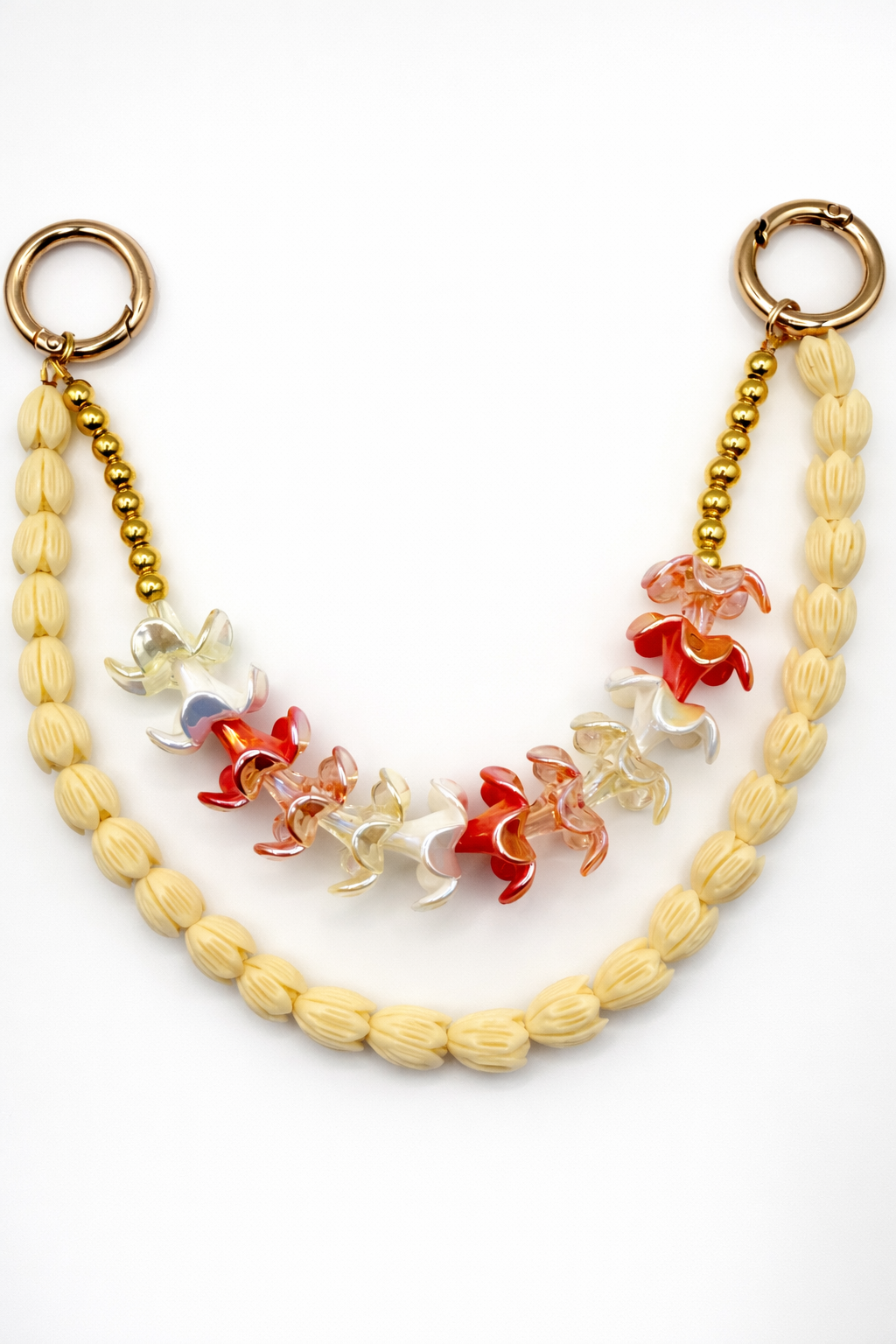 Kenna charm in Puakenikeni with gold-tone clasp and floral-inspired translucent beads