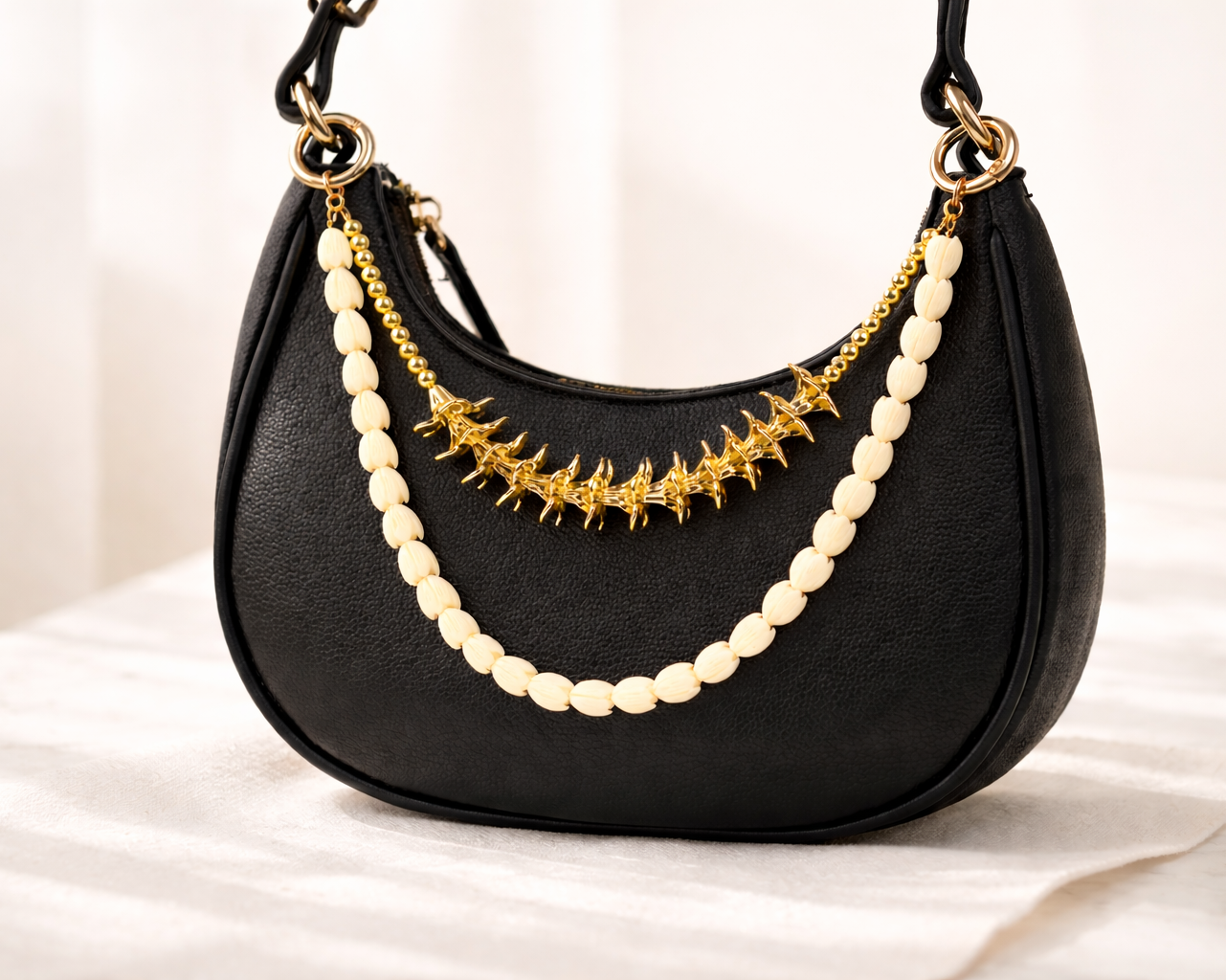 Bag charm with double strands of gold plumeria and pikake; Hawaii inspired 