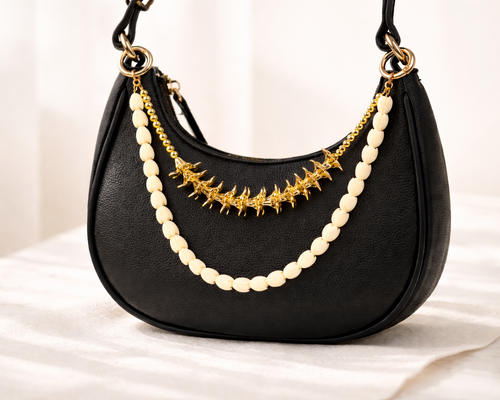 Bag charm with double strands of gold plumeria and pikake; Hawaii inspired 